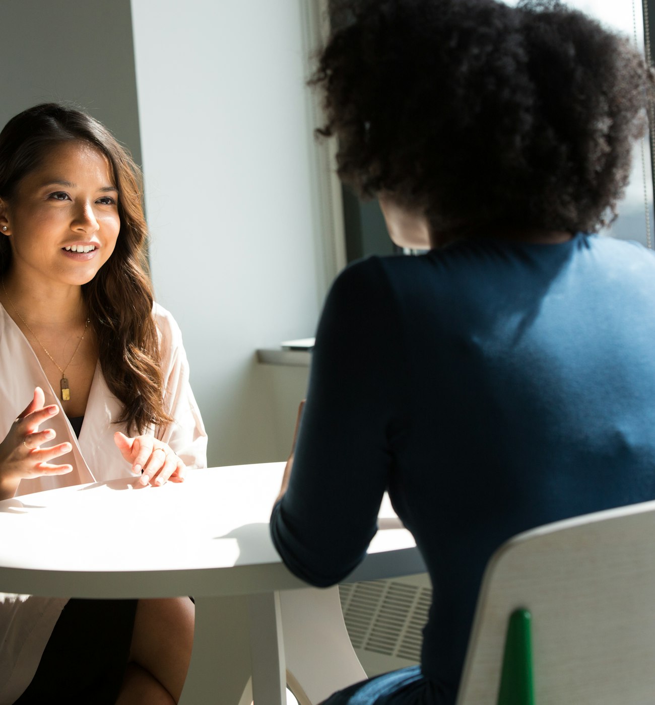 Two women talking during a research interview